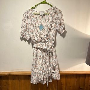 Brand new never wore white floral mid sleeve dress. Smoke free pet free home